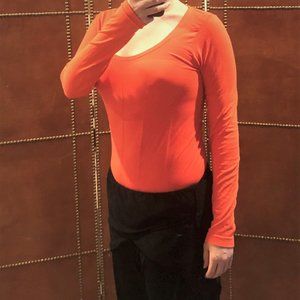Fablet's bright orange long-sleeved workout shirt